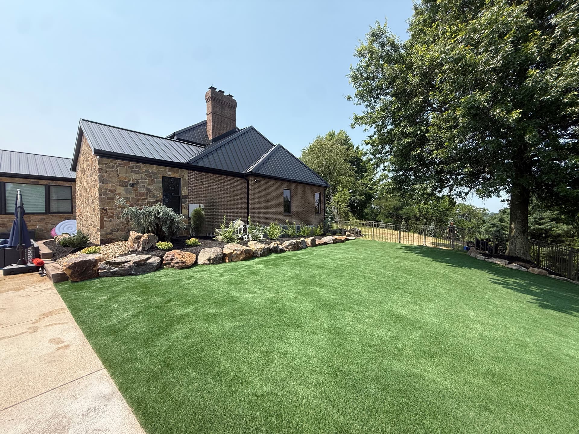 Turf Install and Boulder Landscape Design That Actually Holds Up