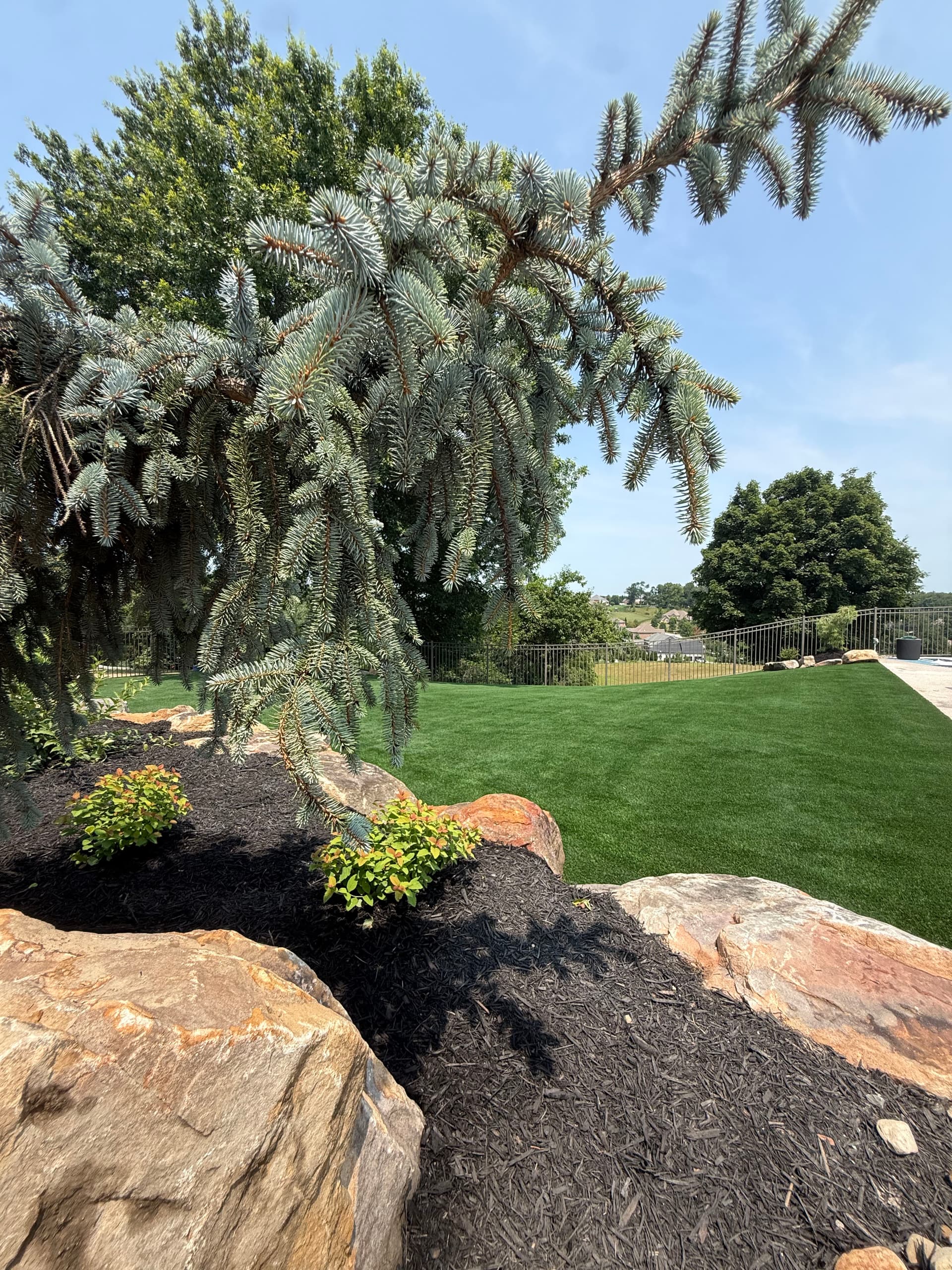 Turf Install and Boulder Landscape Design That Actually Holds Up