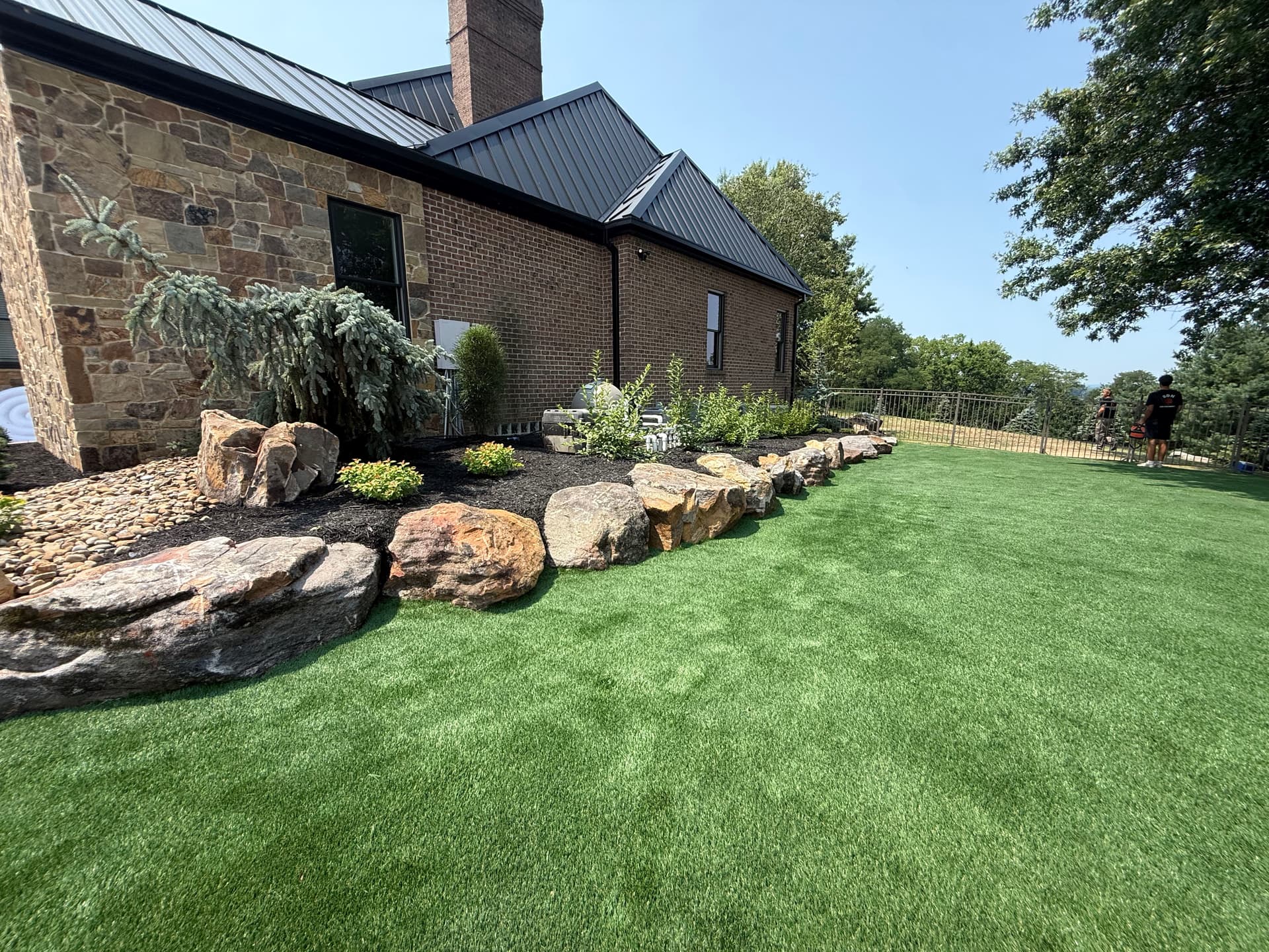 Turf Install and Boulder Landscape Design That Actually Holds Up