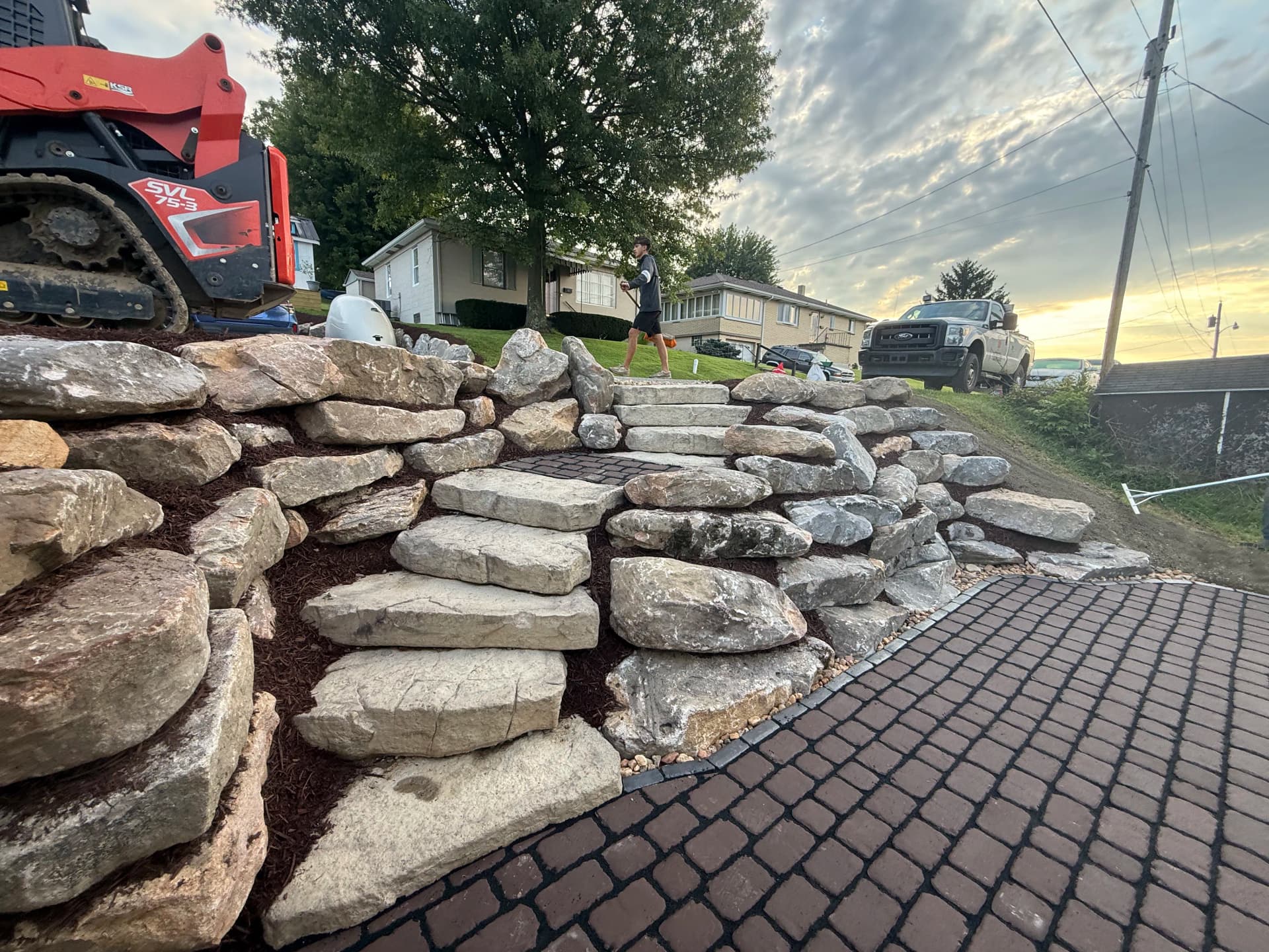 Gallery photos for Steep Driveway Slope Gets a Boulder Wall and Paver Patio Upgrade: Image #1