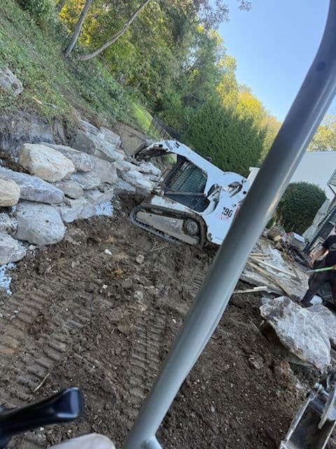 Boulder Retaining Wall and Patio Expansion by BDH Landscaping image